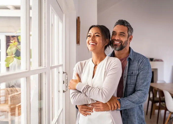 couple hugging each other.